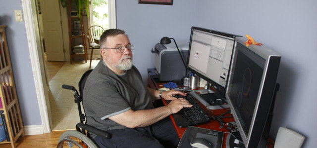 Developmentally disabled gentleman using his computer